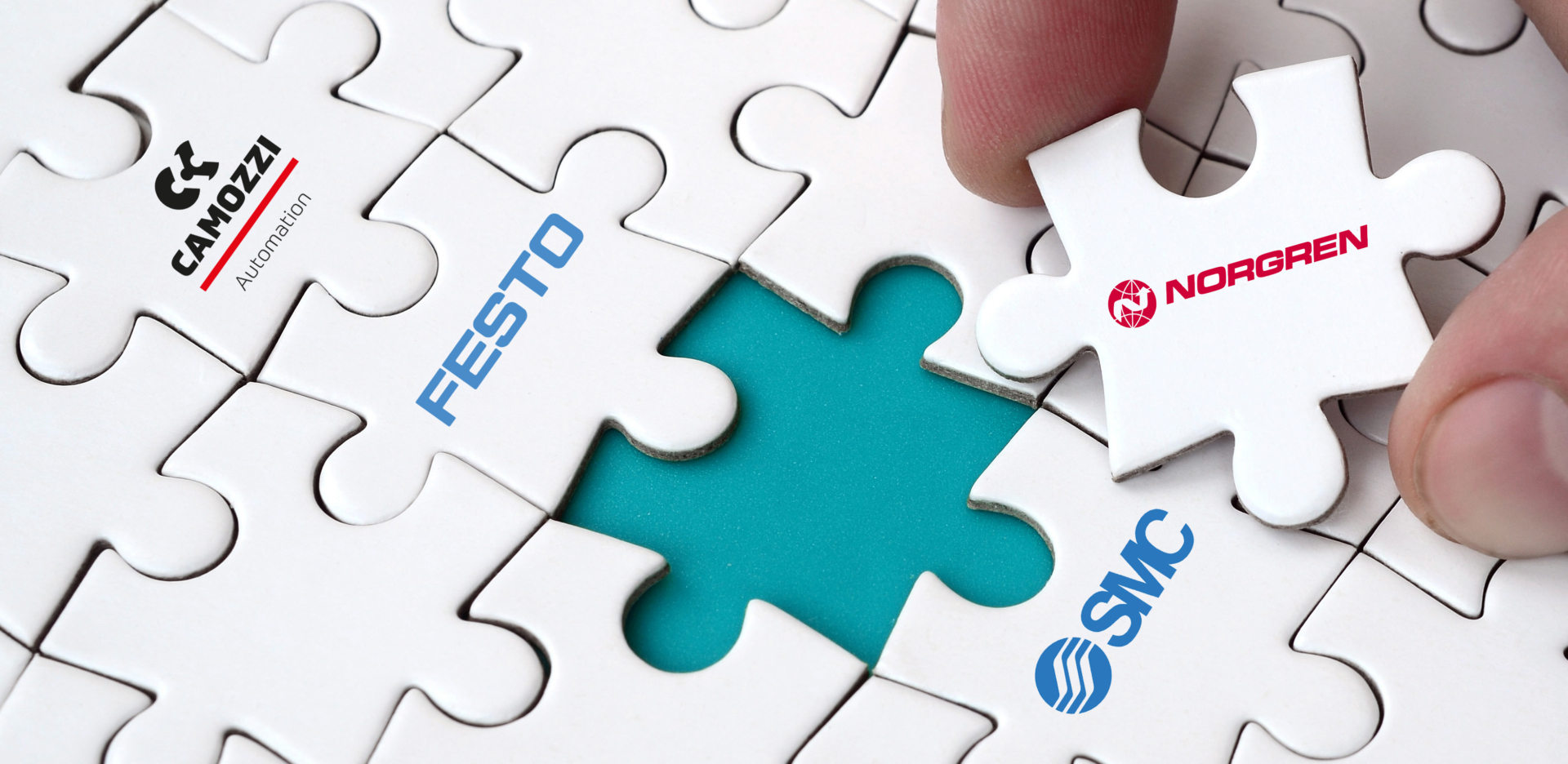 jigsaw puzzle piece with Norgren logo being placed into puzzle