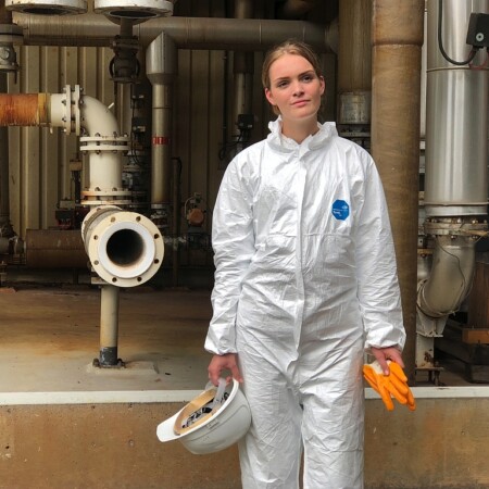 DuPont Tyvek 500 Xpert hooded coverall being worn in an industrial setting