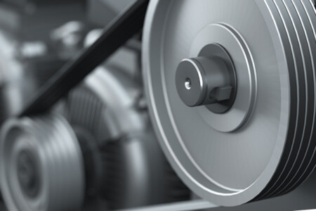 artist's impression of a v-belt attached to two pulleys on an industrial drive train.