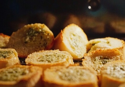 baked goods being baked garlic bread